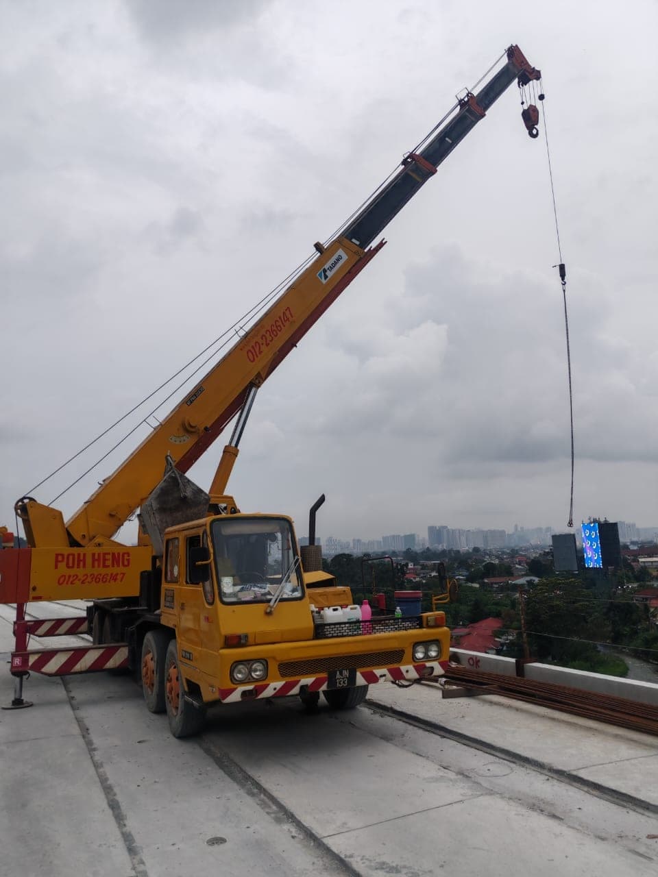 Poh Heng Crane Tadano mobile crane working on an elevated deck in the Klang Valley